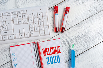 Canvas Print - Text sign showing Welcome 2020. Business photo text New Year Celebration Motivation to Start Cheers Congratulations Extracted blood sample vial with medical accessories ready for examination