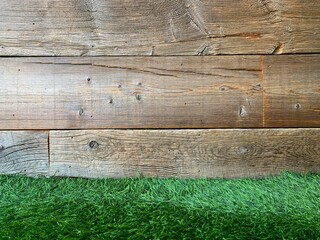 Grass and old wooden wall