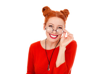 woman in her 30s holding round eye glasses smiling