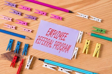 Poster - Text sign showing Employee Referral Program. Business photo text employees are rewarded for introducing recruits Colored clothespin papers empty reminder wooden floor background office