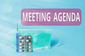 Fototapete - Writing note showing Meeting Agenda. Business concept for items that participants hope to accomplish at a meeting Primary medical precautionary equipments for health care protection