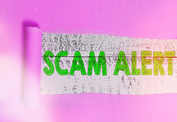 Poster - Text sign showing Scam Alert. Business photo showcasing unsolicited email that claims the prospect of a bargain Rolled ripped torn cardboard placed above a wooden classic table backdrop