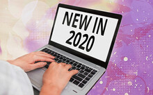 Word Writing Text New In 2020. Business Photo Showcasing What Will Be Expecting Or New Creation For The Year 2020 Modern Gadgets With White Display Screen Under Colorful Bokeh Background