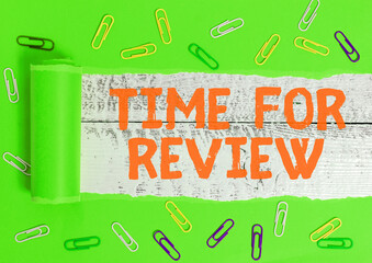 Wall Mural - writing note showing time for review. business concept for review of a system or situation in its fo
