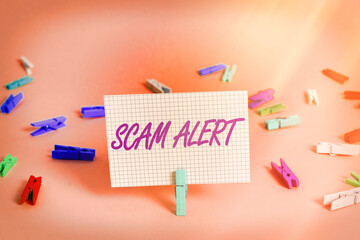 Poster - Writing note showing Scam Alert. Business concept for unsolicited email that claims the prospect of a bargain Colored crumpled rectangle shaped reminder paper light blue background