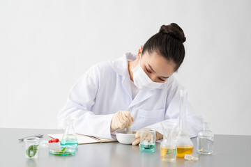 Wall Mural - the scientist doctor making the herb alternative medicine.