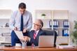 © Elnur - Old boss and young male employee in the office