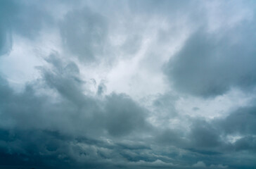 Wall Mural - dark dramatic sky and clouds. background for death and sad concept. gray sky and fluffy white clouds