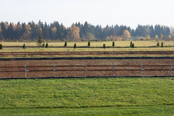 beautiful view of the field with a fence in autumn. free life in a village away from the city