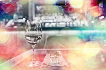 Wall Mural - evening in a restaurant, blurred abstract background, bokeh, alcohol concept, wine glasses in a bar