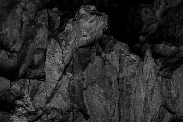 Wall Mural - Black and white rock texture. Stone background. Old weathered mountain surface. Macro. Grunge background.