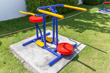 Colorful playground equipment and exercise at grass field outdoor public