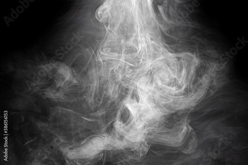 Fotomural Smoke fragments on a black background