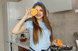 © hetmanstock2 - Healthy eating. Dieting and people concept. Girl with orange.