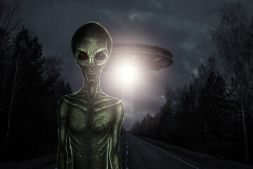 Wall Mural - green alien with black large glass eyes on the background of a flying saucer. ufo concept, aliens, c
