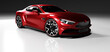 Premium red coupe sports car in studio light.