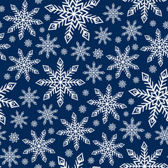 Wall Mural - Beautiful white snowflakes isolated on blue background. Cute festive seamless pattern. Vector flat graphic hand drawn illustration. Texture.