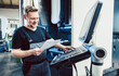 © Kzenon - Worker in industrial workshop programming a cnc machine