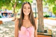 © Krakenimages.com - Young hispanic woman smiling happy walking at the park