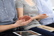 © Iryna - Business people clapping at meeting or conference, close-up of hands. Group of unknown businessmen and women in modern white office. Success teamwork, corporate coaching and applause concept