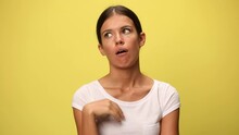 Attractive Casual Woman Being Bored Because Of The Babbling On Yellow Background