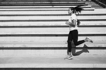 Wall Mural - Strong fitness woman doing morning run on fresh air