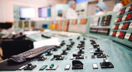 Close-up of buttons and switches control panel of nuclear power plant