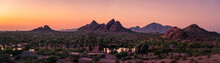 The Sunsets Over Papago Park In Phoenix, Arizona With Camelback Mountain In The Background.