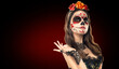 © Subbotina Anna - Sugar skull makeup. Halloween party, traditional Mexican carnival, Santa Muerte. Beautiful young woman costume, painted face.