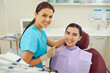 © Studio Romantic - Dentist and woman patient smiling during teeth examination in dentist office