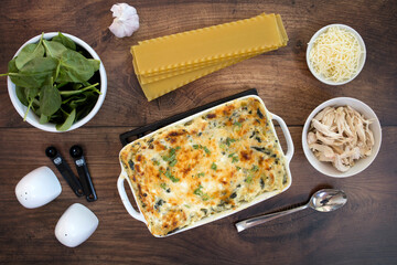 Wall Mural - Chicken Spinach Lasagna on a Wooden Background