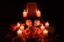 Mexican Day Of The Dead Altar With Bread And Sugar Skulls On Dark Background