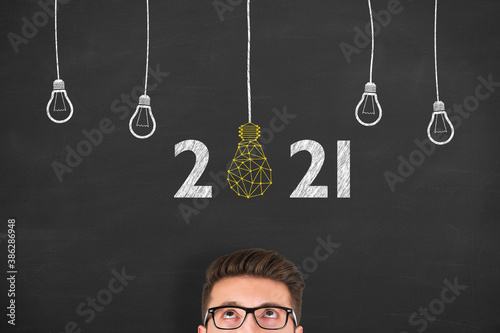 New Year 2021 Innovative Idea Concepts over Human Head on Blackboard Background