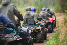 Group Of Riders Riding Atv Vehicle On Off Road Track, Process Of Driving ATV Vehicle, All Terrain Quad Bike Vehicle, During Offroad Competition, Crossing A Puddle Of Mud