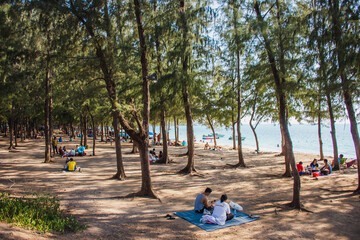 Rayong, Thailand  Dec 13,2019: Tourists relax and swim at Nang Khram Beach.