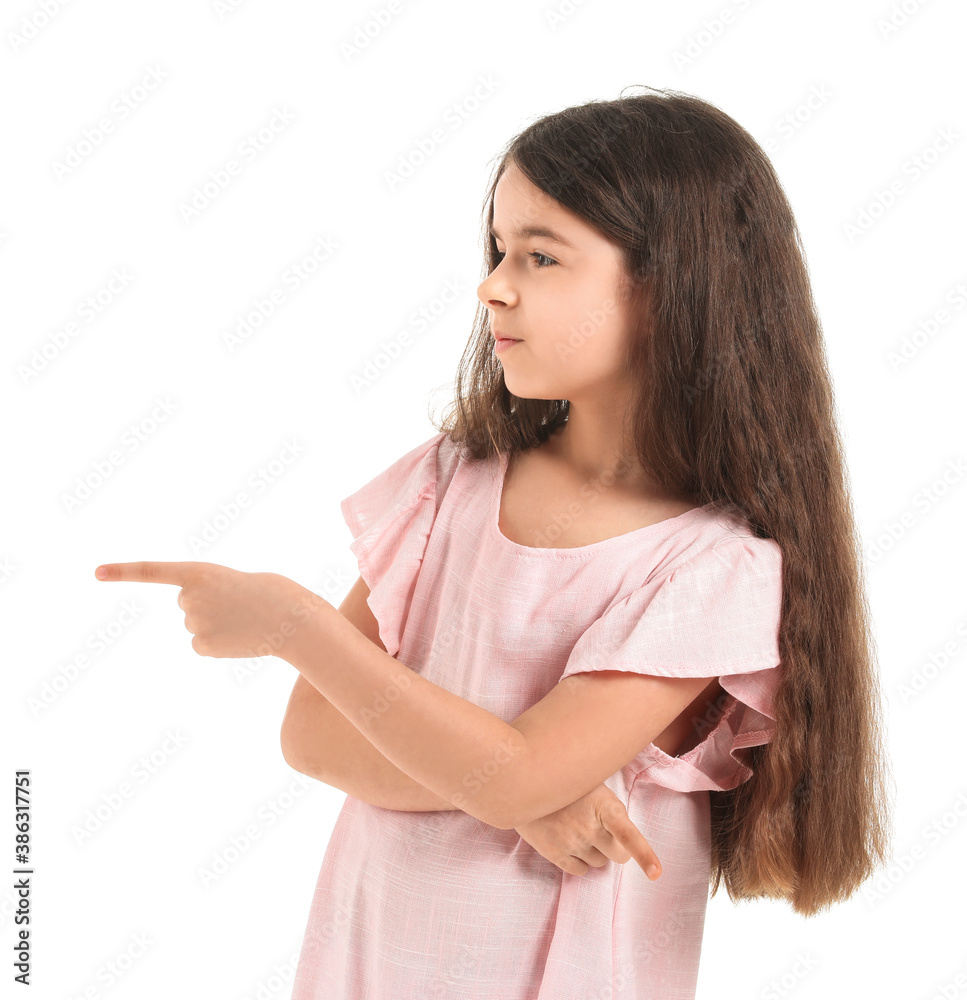 Cute little girl showing something on white background