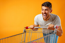 Funny Crazy Man Rushing With Shopping Trolley To Sale