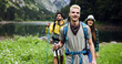 © NDABCREATIVITY - Group of fit healthy friends trekking in the mountains