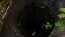 A Look Down To An Old, Exposed Well