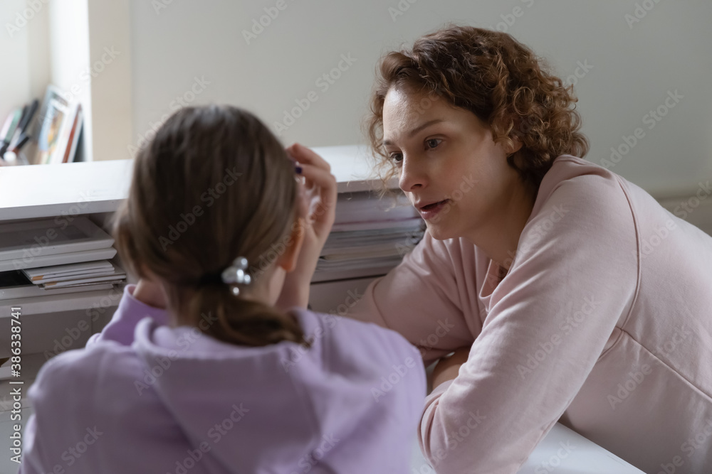 Caring Caucasian mother talk support unhappy upset teen daughter suffering from school bullying or discrimination problems. Loving mom comfort cheer sad teenage girl child, make peace after fight. - obrazy, fototapety, plakaty 