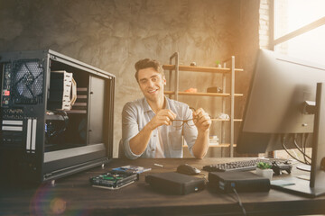 Portrait of his he nice attractive cheerful professional guy expert specialist repairing hardware home-based remote web consulting support at modern loft industrial home office workplace workstation
