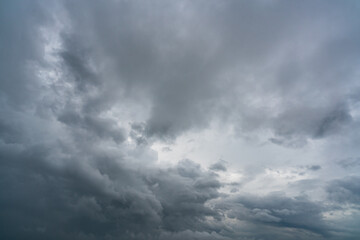 Wall Mural - dark dramatic sky and clouds. background for death and sad concept. gray sky and fluffy white clouds