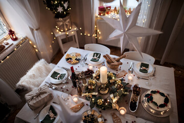 Top view of table set for dinner meal at Christmas time.