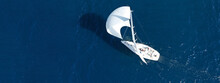 Aerial Drone Ultra Wide Panoramic Photo Of Beautiful Sailboat With White Sails Cruising Deep Blue Sea Near Mediterranean Destination Port
