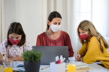 Wall Mural - Group of homeschooling children with teacher studying indoors, coronavirus concept.