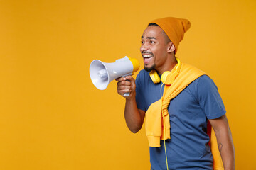 excited cheerful funny young african american man 20s wearing basic casual blue t-shirt hat standing