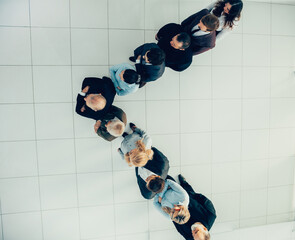 Wall Mural - top view. confident business man standing among his colleagues