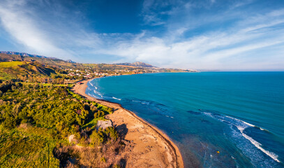 Wall Mural - View from flying drone. Bright morning view of Sciacca town, province of Agrigento, southwestern coast of Sicily, Italy, Europe. Attractive spring seascape of Mediterranean sea.