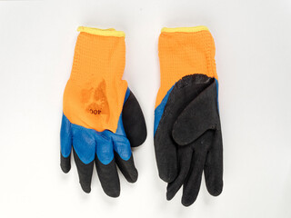 gloves in an assortment of construction gloves for a garden and a vegetable garden on a white background