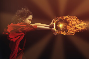 Side view of a young boy in a red and black costume doing kamehameha with a ball of fire, wind blowing in his curly hair